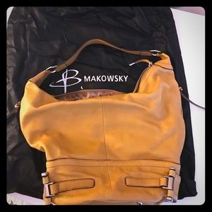 B. Makowsky mustard color hobo bag